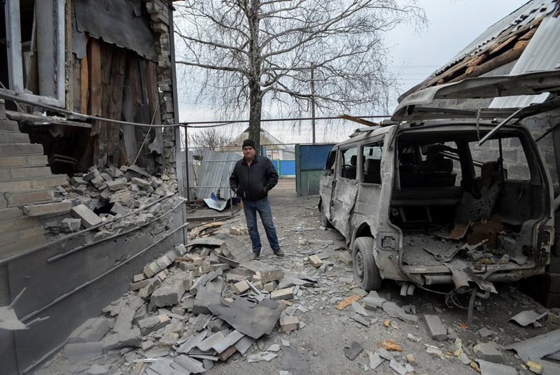 A man outside his house, which was damaged by overnight shelling, in the government-held village of Novoluhanske, Ukraine. (Oleksandr Klymenko/Reuters)